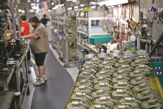 Carburetor components are seen on an assembly line at the Holley Performance Products manufacturing facility in Bowling Green, Kentucky. The signs of stability in manufacturing and low layoffs added to consumer spending data yesterday in suggesting that economic growth regained speed in the second quarter.