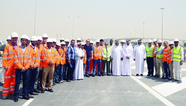 Ashghal officials and representatives of the contractor are seen near the new bridge