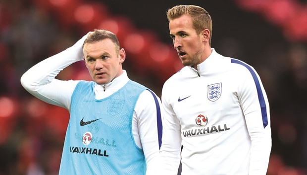 Englandu2019s Harry Kane and Wayne Rooney warm up before the friendly match against Portugal at the Wembley Stadium. England won the match by a solitary goal.