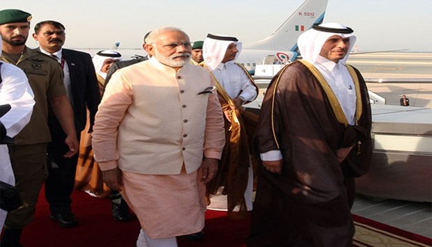 HE the Prime Minister and Minister of Interior Sheikh Abdullah bin Nasser bin Khalifa Al-Thani welcomes Prime Minister Narendra Modi  upon arrival at Hamad International Airport