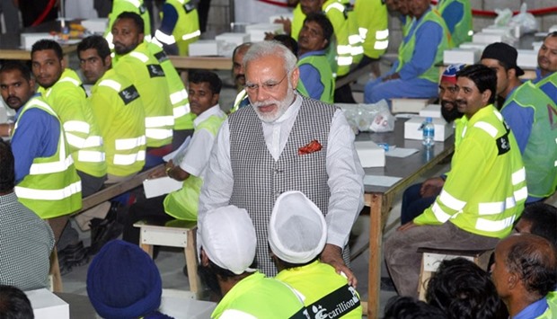PM Modi interacts with some of the workers after his speech