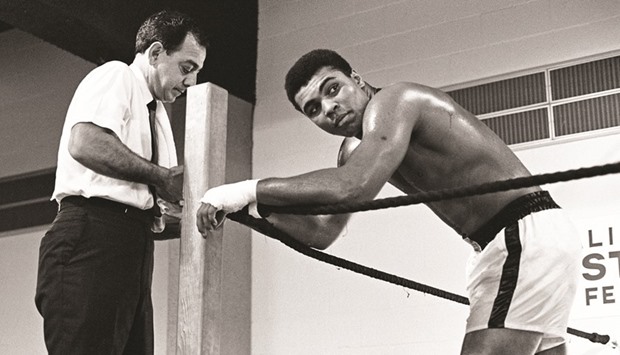 Mohamed Ali (R) is seen here with his trainer Angelo Dundee ahead of his fight with Ernie Terrell at the Astrodome, Houston, Texas, US on Feburary 6, 1967.