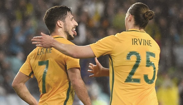 Australiau2019s Matthew Leckie celebrates with teammate Jackson Irvine after scoring against Greece in their friendly match in Sydney. (AFP)