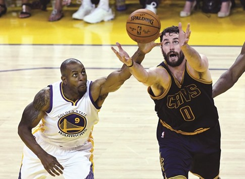 Golden State Warriors forward Andre Iguodala (L) and Cleveland Cavaliers forward Kevin Love go for a loose ball during the second quarter in game one of the NBA Finals at Oracle Arena. PICTURE: USA TODAY Sports