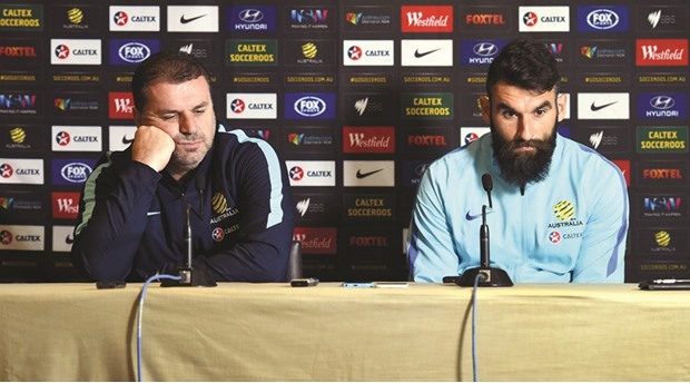 Australian football coach Ange Postecoglou (left).