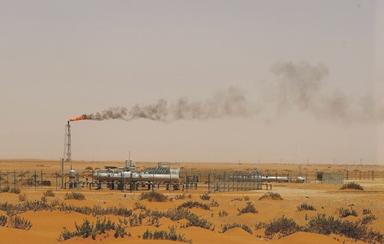 A picture taken on June 23, 2008 shows a flame from a Saudi Aramco oil facility known as u201cPump 3u201d in the desert near the oil-rich area of Khouris, 160km east of capital Riyadh. State-owned Saudi Arabian Oil Co increased its official selling price for Arab Light crude by 35 cents a barrel to 60 cents more than the regional benchmark for sales to Asia, it said in an e-mailed statement.