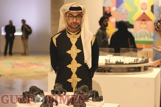 STATEMENT: Othman M R Khunji with his artwork, The Selfless Holy Ground. The work is a criticism of how technological advancements and their u2018misuseu2019 by humans is impacting the u2018Holy Land.u2019  Photo: Umer Nangiana