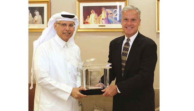 Al-Muhannadi receiving the award from Peter Cella, president and CEO of Chevron Phillips Chemical Company.