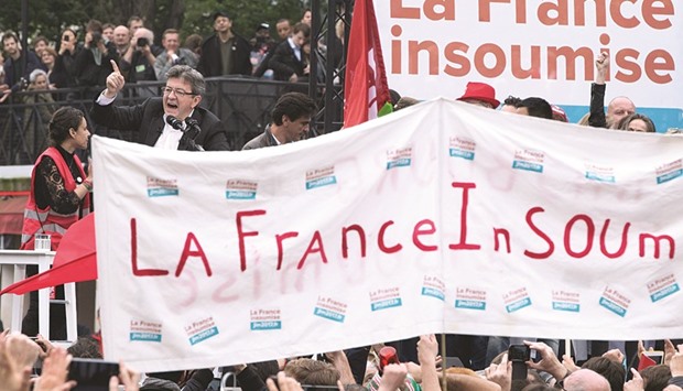 French Parti de Gauche leader and presidential candidate Jean-Luc Melenchon (left) gestures during a speech at u201cLa France Insoumiseu201d (Unsubmissive France) movement at Place de Stalingrad in Paris yesterday.