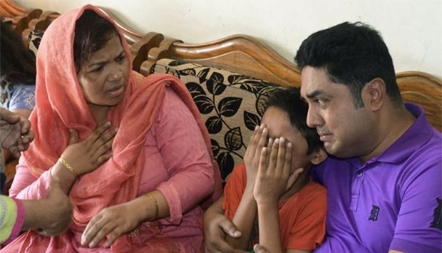 The young son of Mahmuda Aktar mourns after she was shot dead near her home in Chittagong on Sunday.