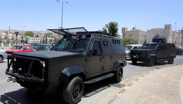 Security vehicles patrolling near the Jordanian intelligence agency office in the Baqaa camp north of Amman on Monday following a gun attack.