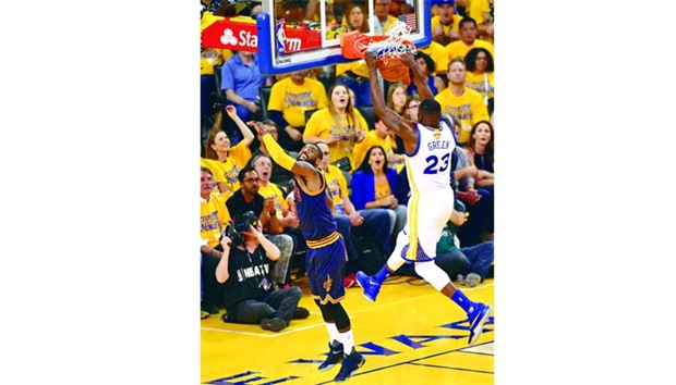 Golden State Warriors forward Draymond Green dunks the ball against the Cleveland Cavaliers during Game 2 of the NBA Finals in Oakland, California. Draymond Green scored 28 points as the defending champion Golden State overwhelmed Cleveland 110-77, pushing the Warriors halfway to a title repeat. (AFP)