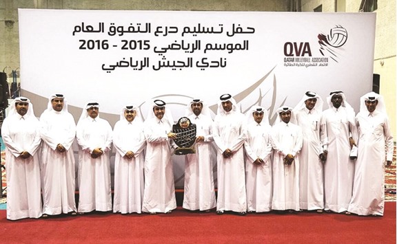 Qatar Volleyball Association (QVA) president Khalid Ali al-Mawlawi presents the Excellence Trophy to El Jaish secretary general Khamis al-Kuwari at the QVA Hall in Doha on Sunday. The honour was given to El Jaish for their impressive season, in which they defeated Al Arabi 3-1 to win the season-opening QVA Cup, besides reaching the finals of the prestigious Emiru2019s Cup and Qatar Cup. PICTURE: Othman Iraqi