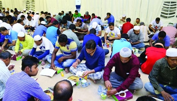 People having the free Iftar meal at one of the tents in Doha. PICTURE: Jayan Orma.