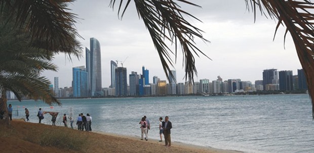 Tourists gather at Abu Dhabi sea front (file). Abu Dhabiu2019s economic growth will rebound next year as the richest member of the UAE revives delayed projects including a planned branch of the Guggenheim Museum, a senior official has said.