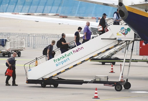 Passengers enter an aircraft at Hahn airport 100 kilometres west of Frankfurt. Shanghai Yiqian Trading Company is planning to buy the airport to secure a base for food exports as well as passengers heading to and from Asia, a deal highlighting Chinau2019s increasing appetite for overseas infrastructure assets.