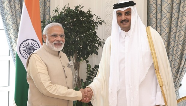 HH the Emir Sheikh Tamim bin Hamad al-Thani shaking hands with  Prime Minister Narendra Modi prior to their official talks at the Emiri Diwan yesterday.