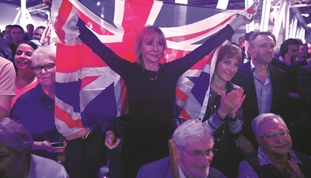 A Brexit supporter holding a Union Flag at a u201cVote Leaveu201d rally in London.