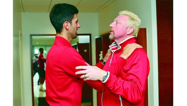 Novak Djokovic, who took Boris Becker (right) on as a coach for the 2014 season, won his first French Open to become only the eighth man to complete a career Grand Slam. (AFP)