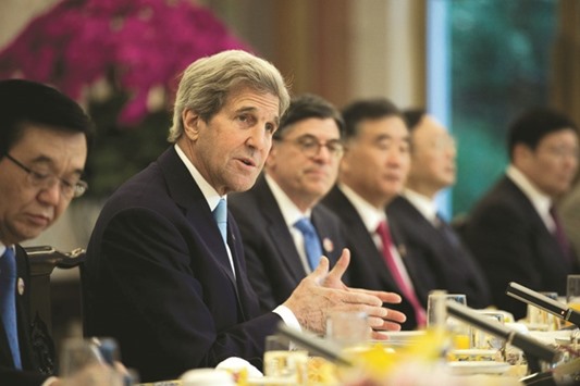 US Secretary of State John Kerry (2nd from left) delivers a speech next to US Treasury Secretary Jacob Lew (centre), Chinese vice premier Wang Yang  (3rd from right) and Chinau2019s State Councillor Yang Jiechi (2nd right) as they take part in a roundtable breakfast with CEOs during the US-China Strategic and Economic Dialogues at Diaoyutai State Guesthouse in Beijing yesterday. China said it will give the US a 250bn yuan ($38bn) investment quota for the first time to buy Chinese stocks, bonds and other assets, deepening financial ties and interdependence between the worldu2019s two largest economies.