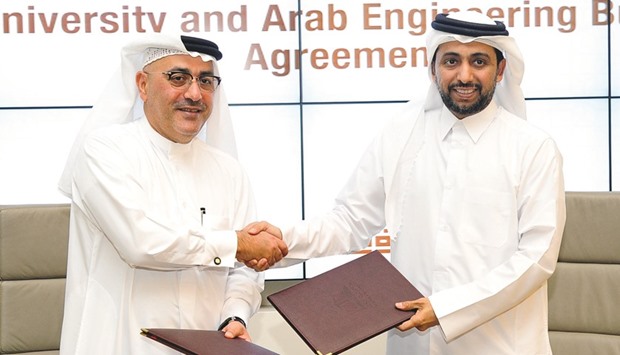 QU president Dr Rashid al-Derham (right) and AEB Group CEO Ibrahim Mohamed Jaidah led the signing of the agreement yesterday.