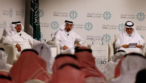 Saudi Minister of Water, Environment and Agriculture Abdul Rahman al-Fadli,  Saudi Energy Minister Khalid al-Falih and Minister of Hajj and Umrah Mohammad Benten attend a news conference announcing the kingdom's National Transformation Plan, in Jeddah on Tuesday.