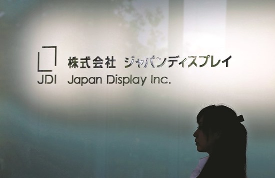 The logo of Japan Display is seen at the companyu2019s new production line for LCD panels in its factory in Mobara, Chiba prefecture. Japan Display reported a u00a531.8bn loss for the year that ended in March, citing weak demand for its smartphone displays.