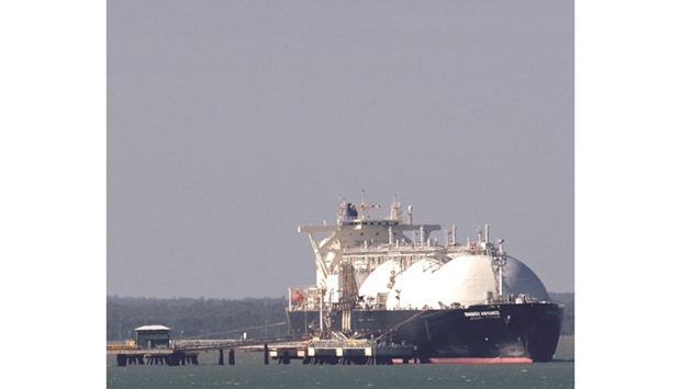 An LNG tanker is moored at ConocoPhillipsu2019 LNG facilities in Darwin, Australia (file). The cancellation or deferment of investment decisions on several projects in Australia, Canada, the US and elsewhere seems to perfectly illustrate the view that no new LNG will be coming to market once the plants currently under construction are completed.