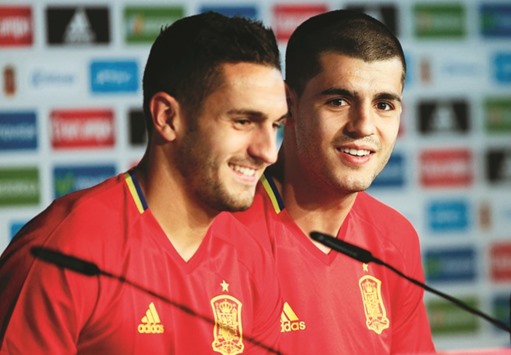 Spainu2019s Jorge u2018Kokeu2019 Resurreccion (left) and Alvaro Morata smile during a news conference in Saint Martin de Re, France, yesterday. (Reuters)