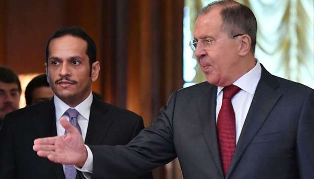 Russian Foreign Minister Sergei Lavrov (R) welcomes Foreign Minister of Qatar Mohammed bin Abdulrahman bin Jassim Al-Thani during their meeting in Moscow. AFP