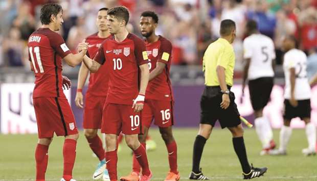 Alejandro Bedova (left) and Christian Pulisic of the US celebrate their win over Trinidad & Tabago during the FIFA 2018 World Cup Qualifier in Commerce City, Colorado, on Thursday. (AFP)