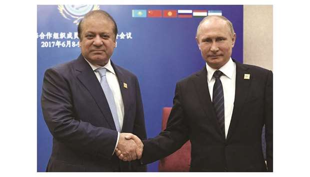 Russian President Vladimir Putin and Pakistani Prime Minister Nawaz Sharif shake hands during a meeting on the sidelines of the Shanghai Co-operation Organisation (SCO) summit in Astana, Kazakhstan, on June 9.