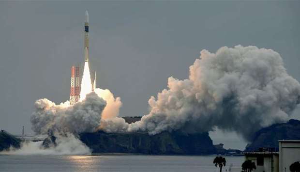 A H-IIA rocket, carrying a Michibiki 2 satellite, lifts off from the launching pad at Tanegashima Space Center