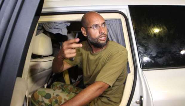 Saif al-Islam Kadhafi, son of Libyan leader Moamer Kadhafi, appearing in front of supporters and jou