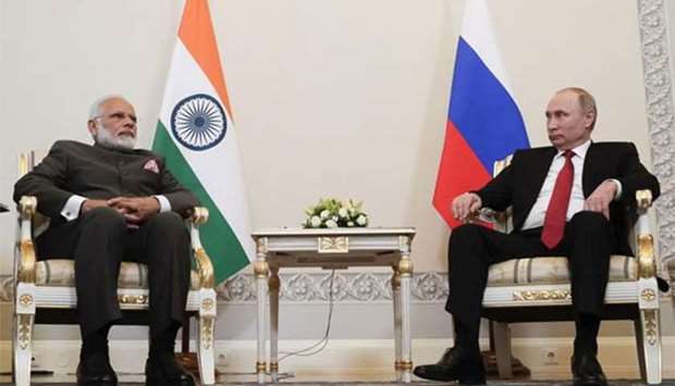 Russian President Vladimir Putin meets with Indian Prime Minister Narendra Modi on the sidelines of the St. Petersburg International Economic Forum on Thursday.