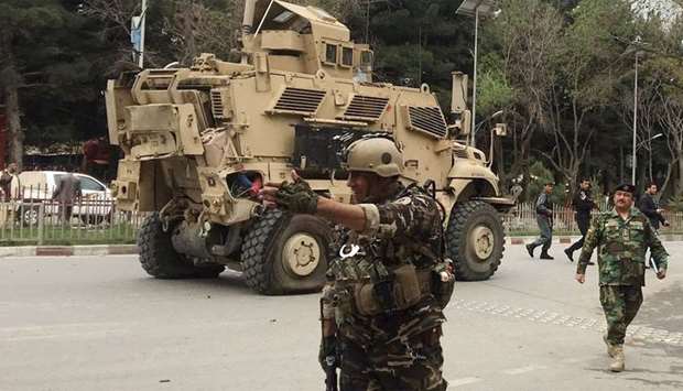 US military vehicle is seen at the site of a suicide bomb attack