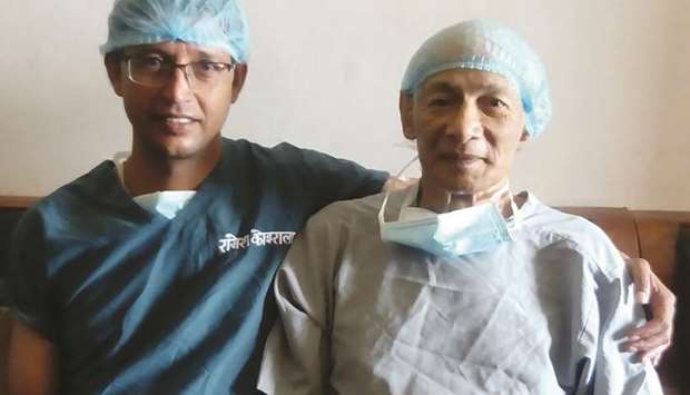 Dr Raamesh Koirala, left, poses for a photograph before performing open heart surgery on Charles Sobhraj in Kathmandu.