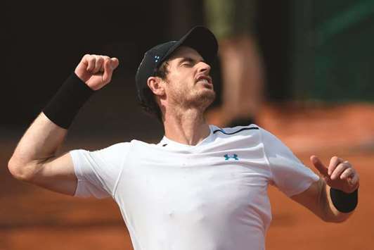 Britainu2019s Andy Murray celebrates after winning his match against Slovakiau2019s Martin Klizan at the Roland Garros in Paris yesterday. (AFP)