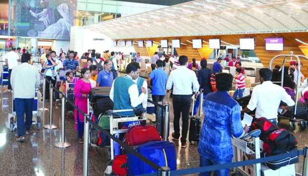 Passengers wait for their turn at the check-in counters of Hamad International Airport. PICTURE: Jayan Orma.