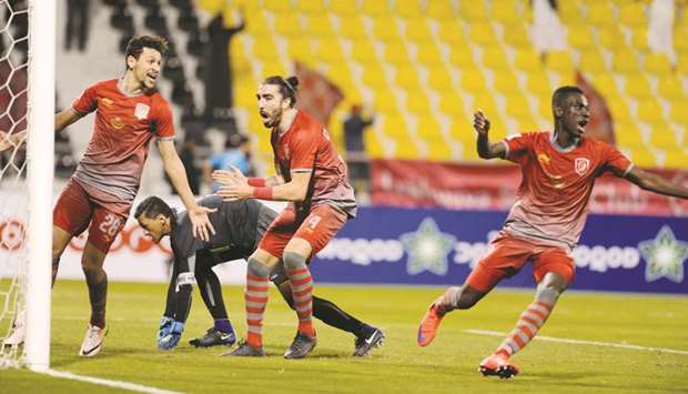 File picture of Lekhwiyau2019s Almoez Ali (right) celebrating after scoring the winner against Al Ahli during their Qatar Stars League match at the Qatar Sports Club stadium.