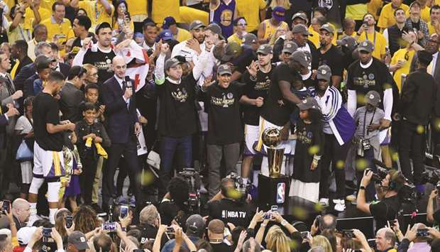 Golden State Warriors players and staff celebrate with the Larry Ou2019Brien Trophy after defeating the Cleveland Cavaliers in game five of the 2017 NBA Finals at Oracle Arena. PICTURE: USA TODAY Sports