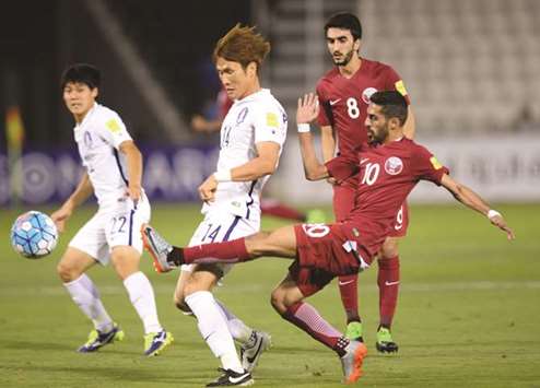  Qatar midfielder Hassan al-Haydous (right) in action during the 2018 World Cup qualifier against South Korea held at the Al Sadd stadium. PICTURE: Noushad Thekkayil