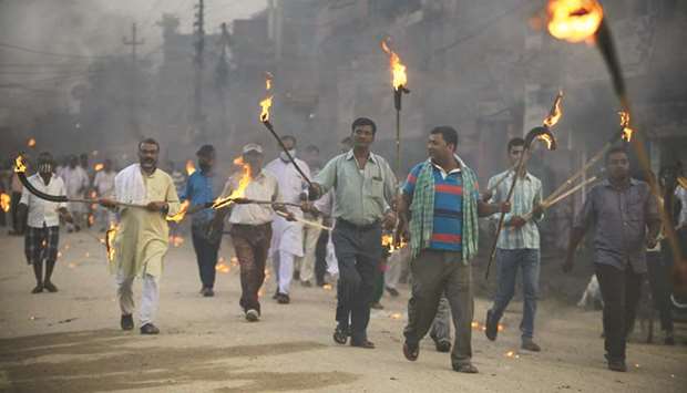 Nepali Madhesi protesters, a marginalised group in the southern plains, hold a torch rally in Janakpur, as they protest against forthcoming local elections.