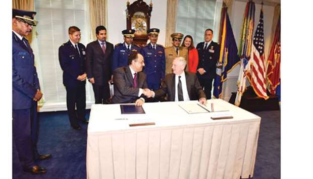 HE the Minister of State for Defence Affairs Dr Khalid bin Mohamed al-Attiyah and US Secretary of Defence James Mattis shake hands after signing the F-15 fighter jets deal.