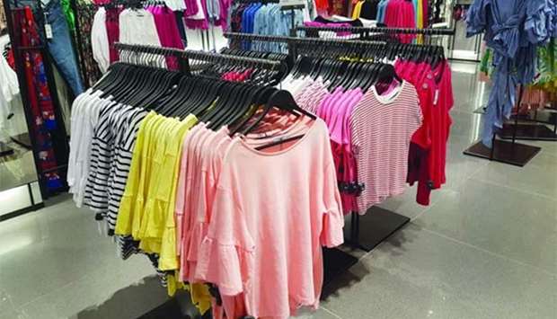 A variety of apparel is on display at a retail outlet.
