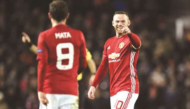 File picture of Manchester Unitedu2019s English striker Wayne Rooney (R) celebrating after teammate Juan Mata scored during the Europa League match against Feyenoord. (AFP)