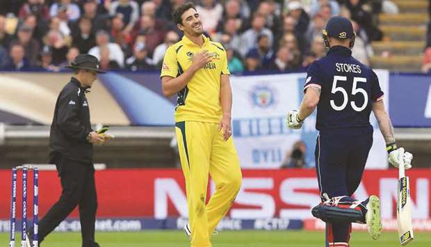 Australiau2019s Mitchell Starc (centre) smiles as Englandu2019s Ben Stokes takes a run during the ICC Champions Trophy match at Edgbaston in Birmingham on June 10, 2017. (AFP)