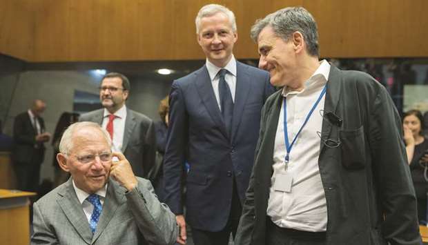 Wolfgang Schaeuble, Germanyu2019s finance minister (left), speaks with Euclid Tsakalotos, Greeceu2019s finance minister (right) asBruno Le Maire, Franceu2019s finance minister, arrives ahead of a Eurogroup meeting of European finance ministers in Luxembourg on Thursday. The u20ac8.5bn of loans from the eurozoneu2019s 18 other states, including Berlin, lets Athens avoid defaulting on bailout repayments next month.