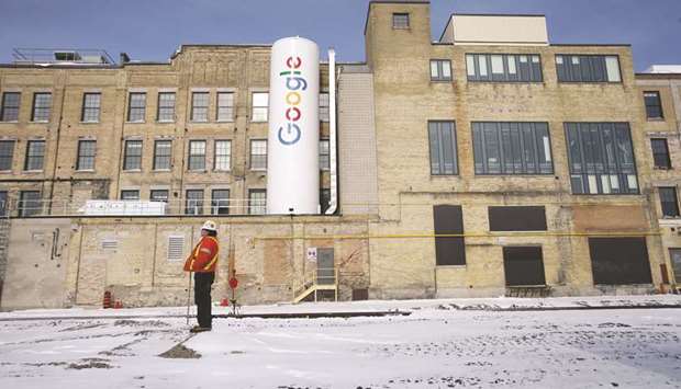 A construction worker stands outside Google Canadau2019s engineering headquarters in Waterloo, Ontario. Google opened the new office in BlackBerryu2019s hometown last year with room for 1,000 engineers.