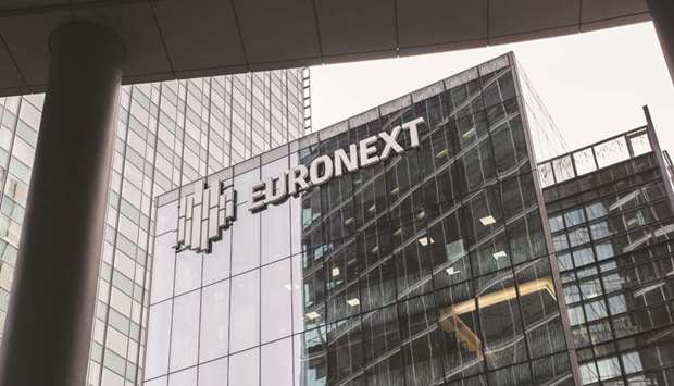 The Euronext logo is seen on the exterior of the Paris stock exchange. Parisu2019 CAC 40 ended 0.9% higher at 5,263.31 points yesterday.